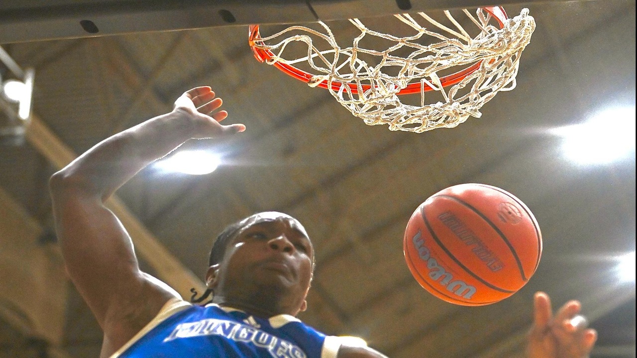 MINGOES vs ELITEH &ndash; UB Mingoes forward Terrence Higgs dunks the ball against The Bamboo Shack Elite during their UB Showcase Series game at The Kendal Isaacs Gymnasium. The Mingoes won 82-71 to end the season with a 14-3 record. (UB ATHLETICS)