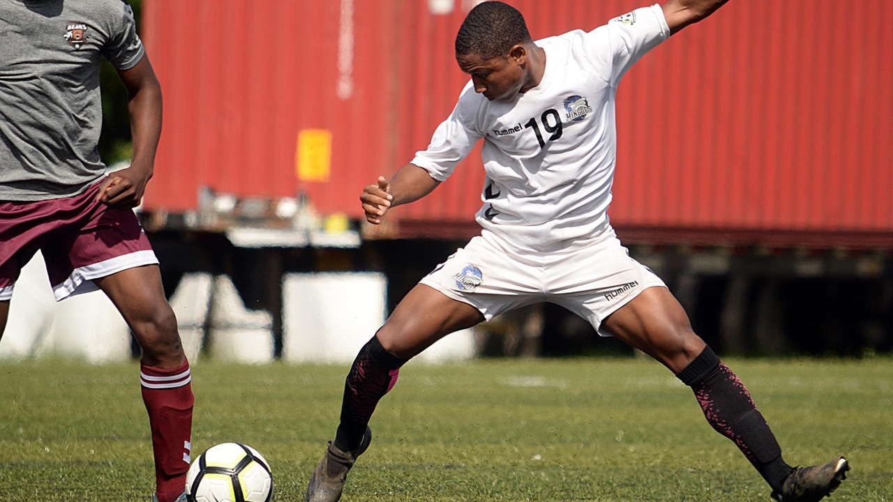 University of The Bahamas midfielder Nathan Wells dribbles the ball past a BearsFC player in their Bahamas Football Association match October 16, 2022 at The Roscow R.L. Davies field.  The Mingoes won 5-1. (UB Athletics)