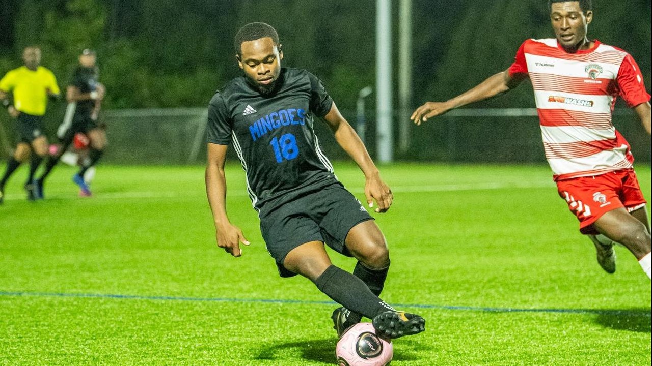 University of The Bahamas Mingoes winger Elijah Mitchell (Black #18) dribbles against Western Warriors Titans Sunday, February 2 at the Roscow Davies Soccer Fields. Mingoes lost 5-1. (UB Athletics)