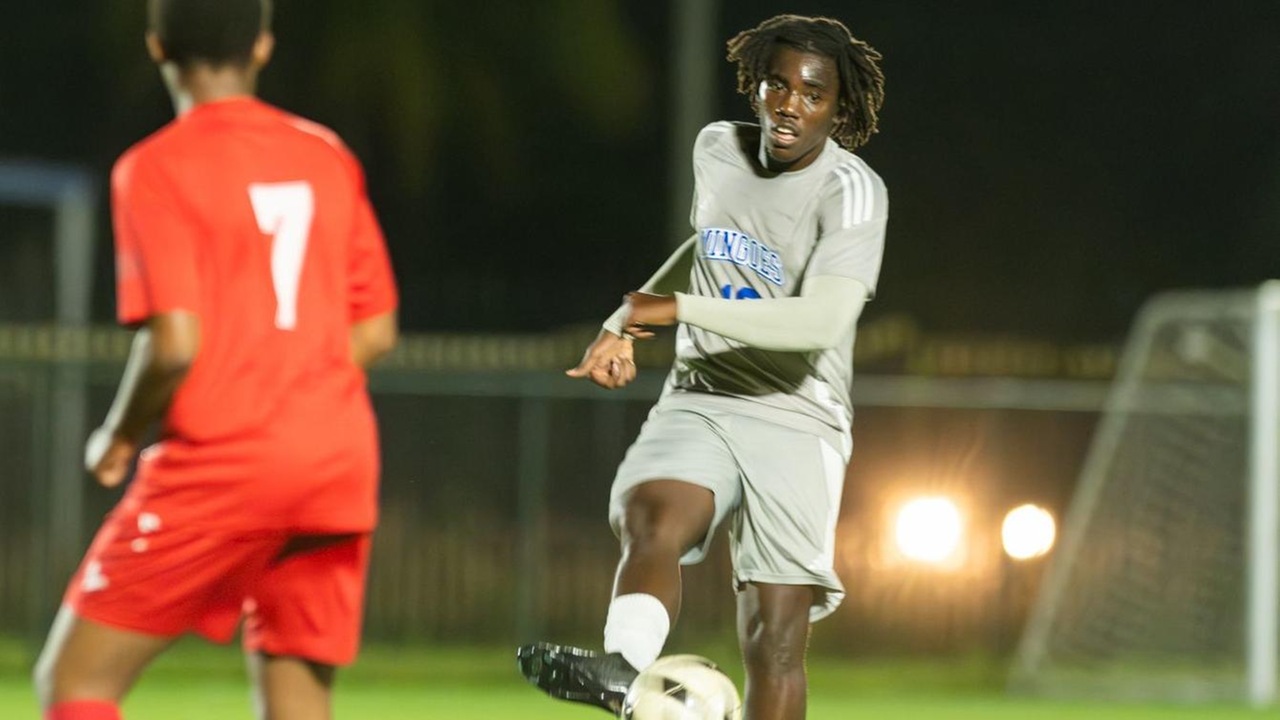 The University of The Bahamas forward Kevin Thomas passes the ball during his match against Cavalier F.C. Sunday, November 16 at the Roscow A.L. Davies Soccer Fields. UB won 11-0. UB ATHLETICS.