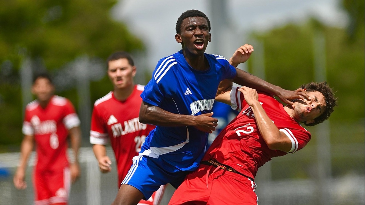 The University of The Bahamas freshman right winger Keno Thomas (Blue) battles with a defender during his match against Atlantis University Saturday, September 20 at the Kendall Soccer Park in Miami, Florida. UB fell 2-0. UB ATHLETICS