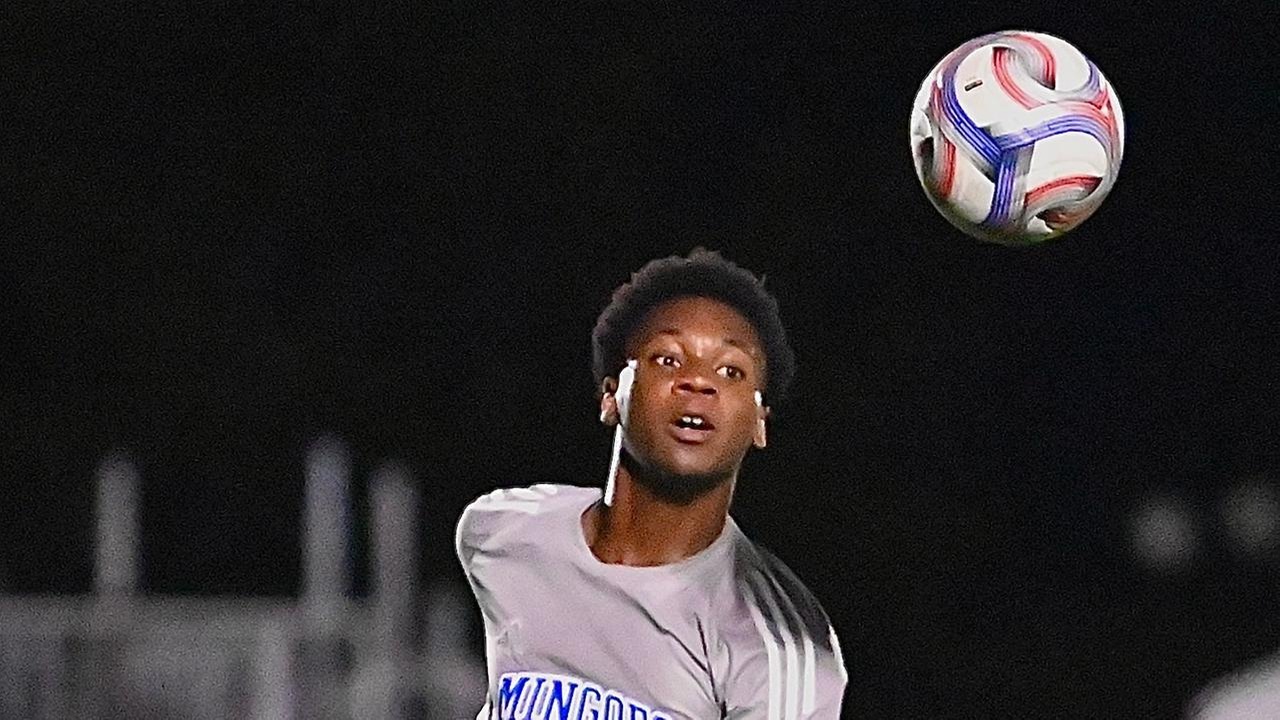 The University of The Bahamas Mingoes men&rsquo;s soccer forward Nahum Johnson (Gray #7) wins the header during his match against Inter Nassau F.C. on Sunday, February 15 at the Roscow A.L. Davies Soccer Fields. UB drew 0-0. UB Athletics.