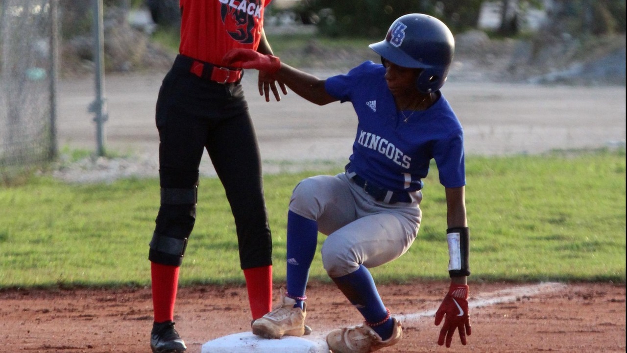 Shortstop Adonya Stanislaus make it safely to third base in the game against the Black Scorions on Saturday, July 27 at Bankers' Field. The Mingoes won 15-8.