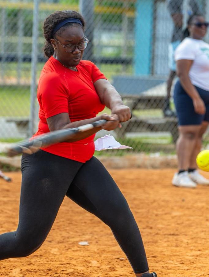 A player swings at a pitch during the University of The Bahamas women's softball tryout on April 18 at the Blue Hills Softball Fields. UB Athletics.