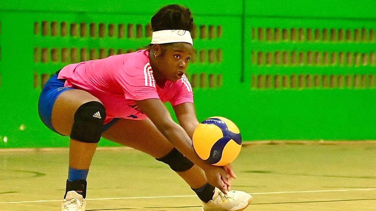 The University of The Bahamas Mingoes women's volleyball middle hitter Anjeniker Joseph goes for the dig