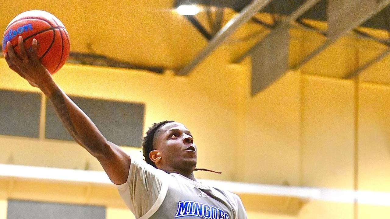 The University of The Bahamas Mingoes guard John Mckenzie (Grey #5) on the attack against Airport Authority on Thursday, January 29 at the Kendal Isaacs Gymnasium. UB won 90-85. UB Athletic